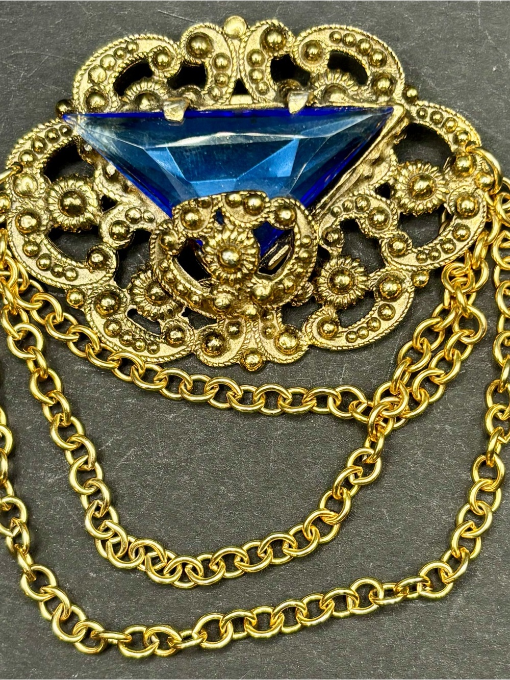 Vintage Gold Tone Filigree Brooch Triangular Blue Glass UV Reactive Chain Pin